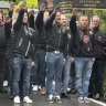 Dozens of people raise their arms to honour Italian dictator Benito Mussolini on the 79th anniversary of his execution. 