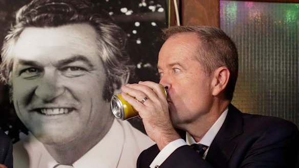 Opposition Leader Bill Shorten has a beer (Hawke's Patio Ale) in memory of former PM Bob Hawke at the John Curtin Hotel in Melbourne on Friday.
