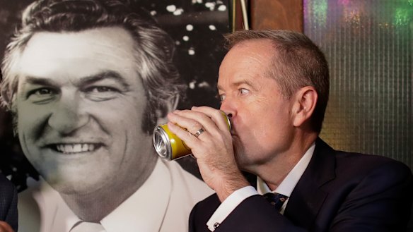 Opposition Leader Bill Shorten has a beer (Hawke's Patio Ale) in memory of former PM Bob Hawke at the John Curtin Hotel in Melbourne on Friday.