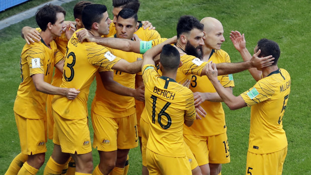 All together now: Togetherness is everything for skipper Jedinak and his Socceroos.