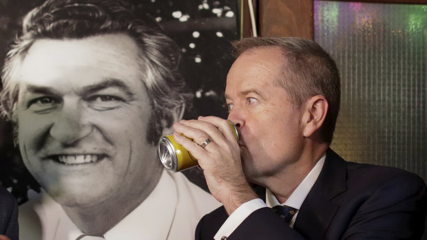 Opposition Leader Bill Shorten has a beer (Hawke's Patio Ale) in memory of former PM Bob Hawke at the John Curtin Hotel in Melbourne on Friday.