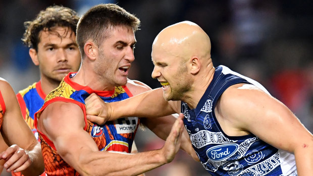 Claws out: Geelong's Gary Ablett scuffles with Gold Coast's Anthony Miles.