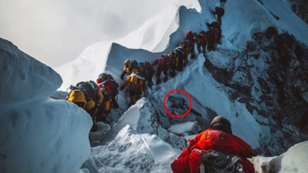 Everest climbers pass a dead body (circled) in May.