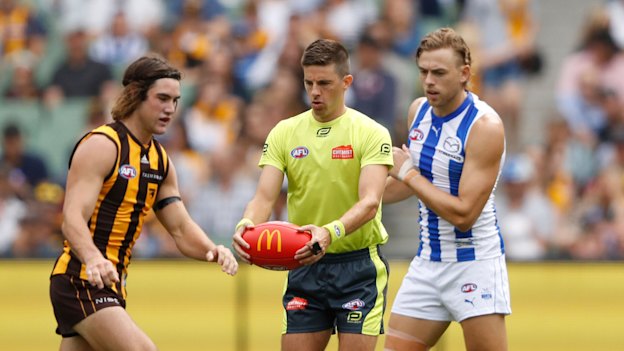 Umpire Michael Pell officiates during the round one AFL match between Hawthorn and North Melbourne at the MCG on March 20.