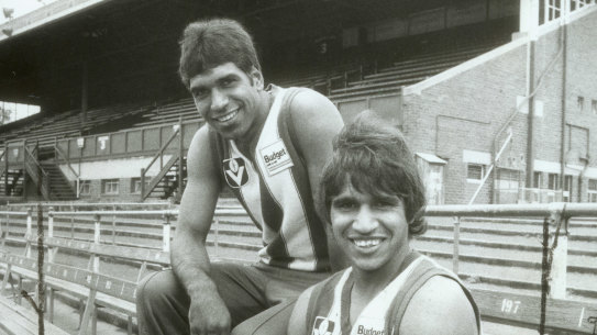 Jim (left) and Phil (right) while playing for North Melbourne in the 1980s.