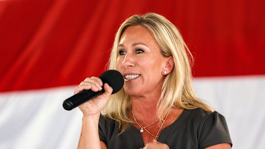 COVID conspiracy theorist Marjorie Taylor Greene speaks at a Republican rally in Georgia. 