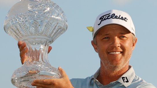 Matt Jones celebrates with the Honda Classic trophy.