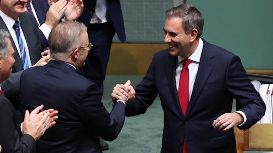 Albanese and Chalmers shake hands.