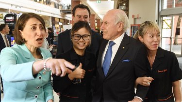 NSW Premier Gladys Berejiklian is joined by former prime minister John Howard as they take to streets in Penrith on Monday.