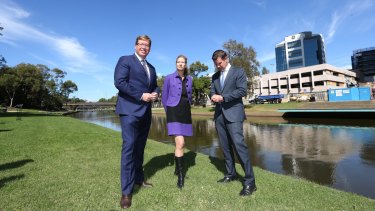 Former NSW premier Mike Baird (right) and then arts minister Troy Grant and MAAS director for the Powerhouse Museum Dolla Merrillees view the new Parramatta location in 2016.