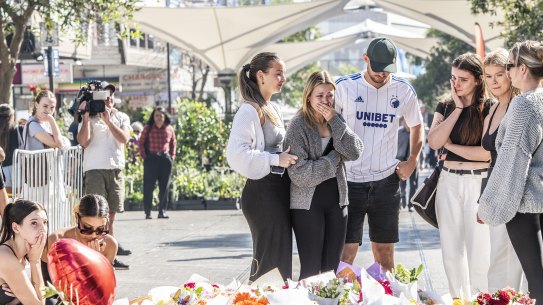 Floral tributes at Bondi Junction.