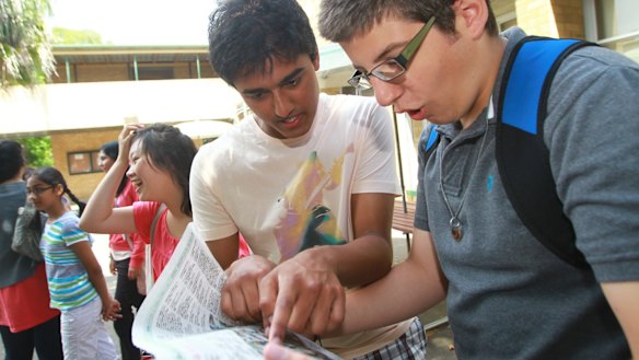Students compare their ATAR results on Friday.