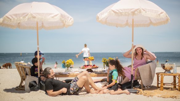 Dane and Megan Campbell with children Eton, Ruby and Violet enjoy a Melbourne Cup picnic like no other at Middle Park Beach.