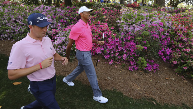 Tickled pink: Justin Thomas and Tiger Woods during a practice round at Augusta National.