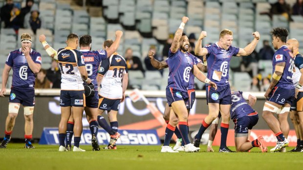 Melbourne Rebels players celebrate a second-half comeback victory over the ACT Brumbies.