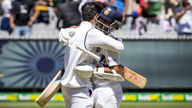 India captain Ajinkya Rahane, right, celebrates with teammate Shubman Gill after their victory in the second Test at the MCG.