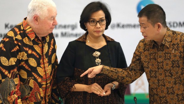 From left to right, Richard Adkerson, CEO of Freeport-McMoRan; Indonesian Finance Minister Sri Mulyani Indrawati; and Energy and Minerals Minister Ignasius Jonan speak prior to the start of a press conference in Jakarta, Indonesia in 2017.