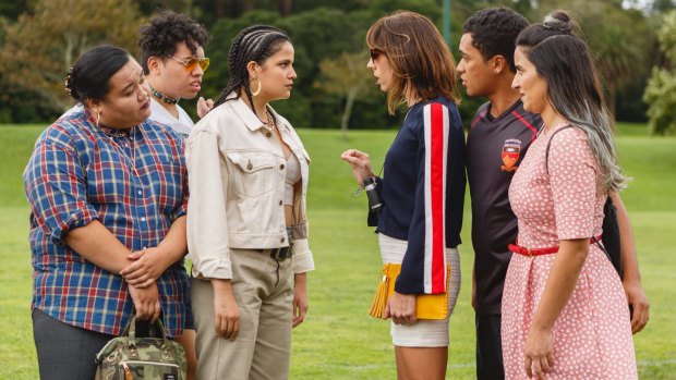 The Breaker Upperers, right, Jackie van Beek in striped top as Jen and Madeleine Sami in pink dress (Mel) with James Rolleston (James) as they confront his girlfriend Sepi (Ana Scotney).