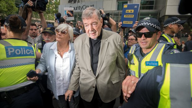 George Pell leaves the County Court in February.