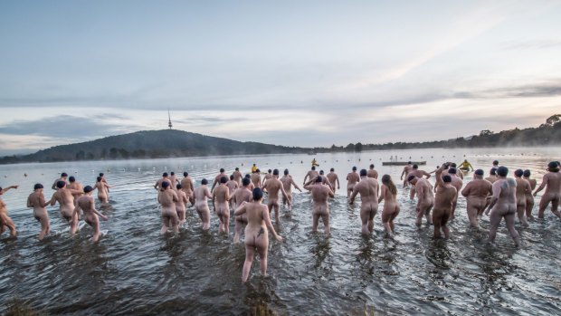 Participants in Canberra's 2018 Winter solstice nude charity swim raised money for local charities Lifeline Canberra and Love your sister by taking a plunge in Lake Burley Griffin on a -3 degree morning. 