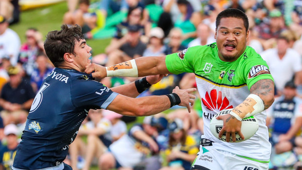 Handyman: Canberra centre Joey Leilua holds off Jake Clifford and looks for an offload.  