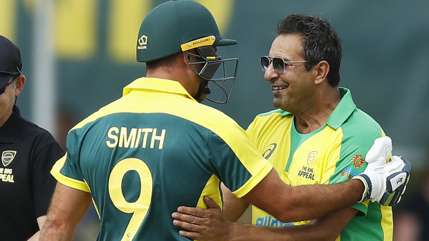 Skittled: Legendary Pakistani paceman Wasim Akram shares a laugh with Cameron Smith after bowling him out for a golden duck.