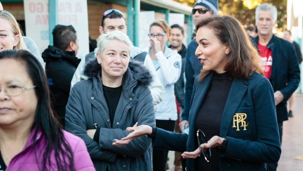 Labor candidate for Cowan Anne Aly talking to voters at Landsdale Primary School in Perth's northern suburbs.