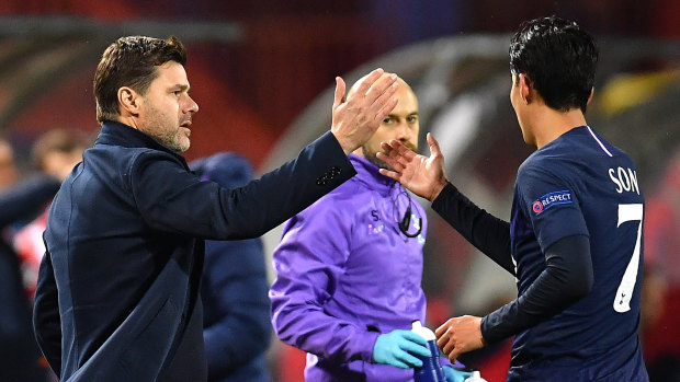 The end nears: Pochettino congratulates Heung-Min Son on scoring during the UEFA Champions League group B match between Crvena Zvezda and Spurs at Rajko Mitic Stadium on November 6.