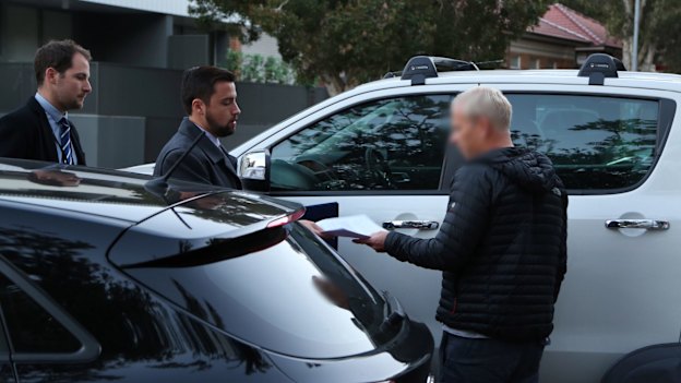 Detectives arrest Hamish McLaren in Bondi in July last year.