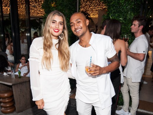 Julia Gelonese and Ussi Moniz at their White Party in Bondi in 2018.