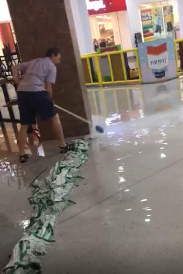Flooding tangeranon shopping center flooded Wednesday after a turbulent storm. 