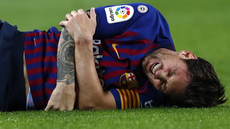 Concern: Lionel Messi suffered an elbow injury in the victory over Sevilla.