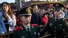 People’s Liberation Army soldiers manage the flow of visitors in Tiananmen Square.