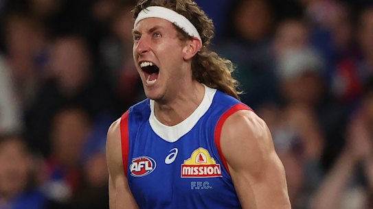 Aaron Naughton of the Western Bulldogs celebrates a goal.