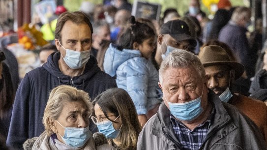 Shoppers with masks at South Melbourne Market