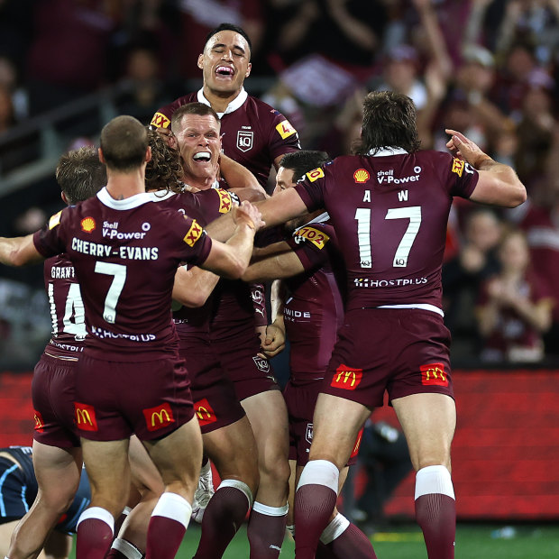 Lindsay Collins and his Maroons teammates celebrate the final try in Adelaide.
