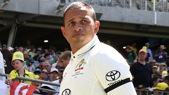 Usman Khawaja wears a black armband.