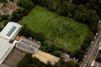 Students on an oval at an evacuated Castle Hill school. 