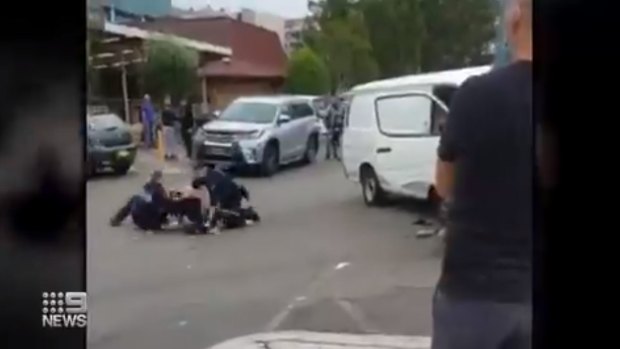 Police struggled to restrain the man after pulling him from the van near Bankstown Central.