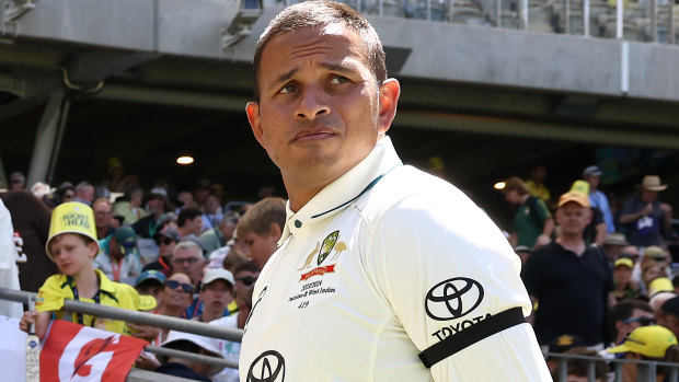 Usman Khawaja wears a black armband.