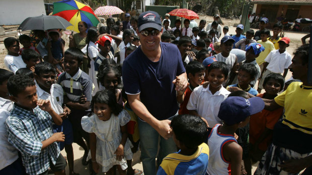 Warne at a tsunami refugee camp in Galle, Sri Lanka in 2005.