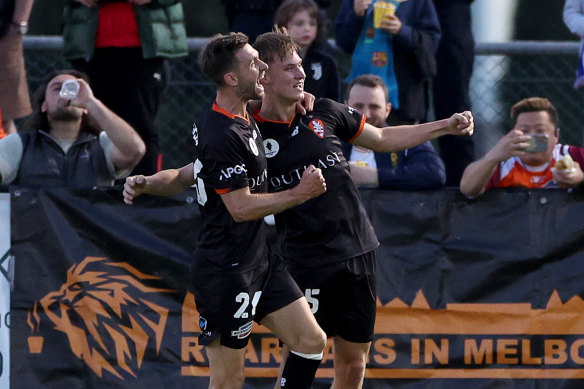 Thomas Waddingham of the Roar, right, celebrates a goal during the Australia Cup 2023 semi-final against the Melbourne Knights in September in Melbourne.