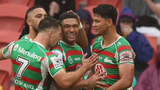 South Sydney celebrate a try by Taane Milne (centre).