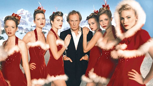 Bill Nighy as Billy Mack and friends in Love Actually.