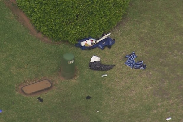 Clothing and other items outside a Glen Alpine home, where a man is believed to have been shot by police.