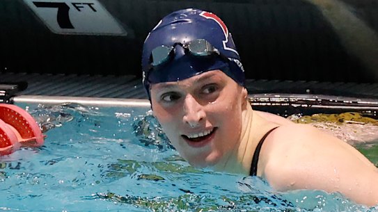Swimmer Lia Thomas smiles after winning the 100-yard freestyle final at the Ivy League women’s championships at Harvard.