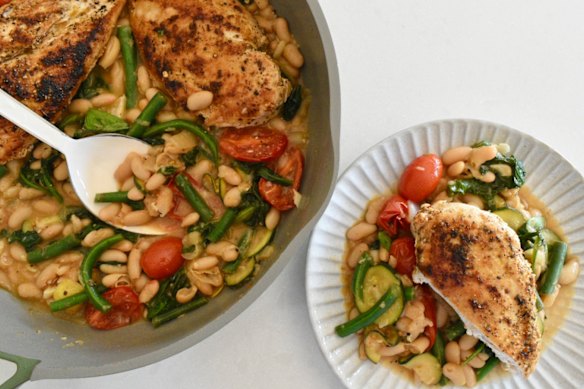 White beans and seasonal vegies add substance to this one-pan chicken dish.