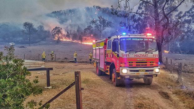 Firefighters from NSW Fire and Rescue battle a fire near Tenterfield.