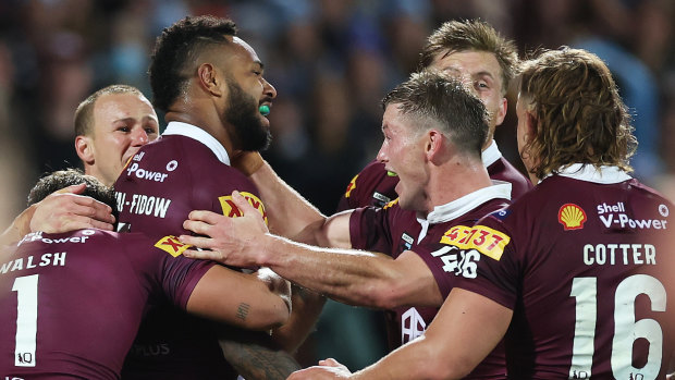 Queensland celebrates a win in the opening State of Origin game.