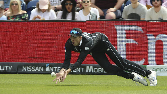 Mitchell Santner in action for the Kiwis.